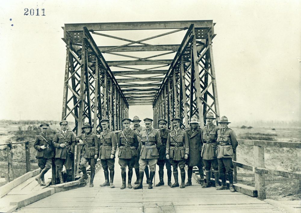 Officers of the New Zealand Tunnelling Company stand on the Canal du Nord bridge near Bapaume, France, October 1918.